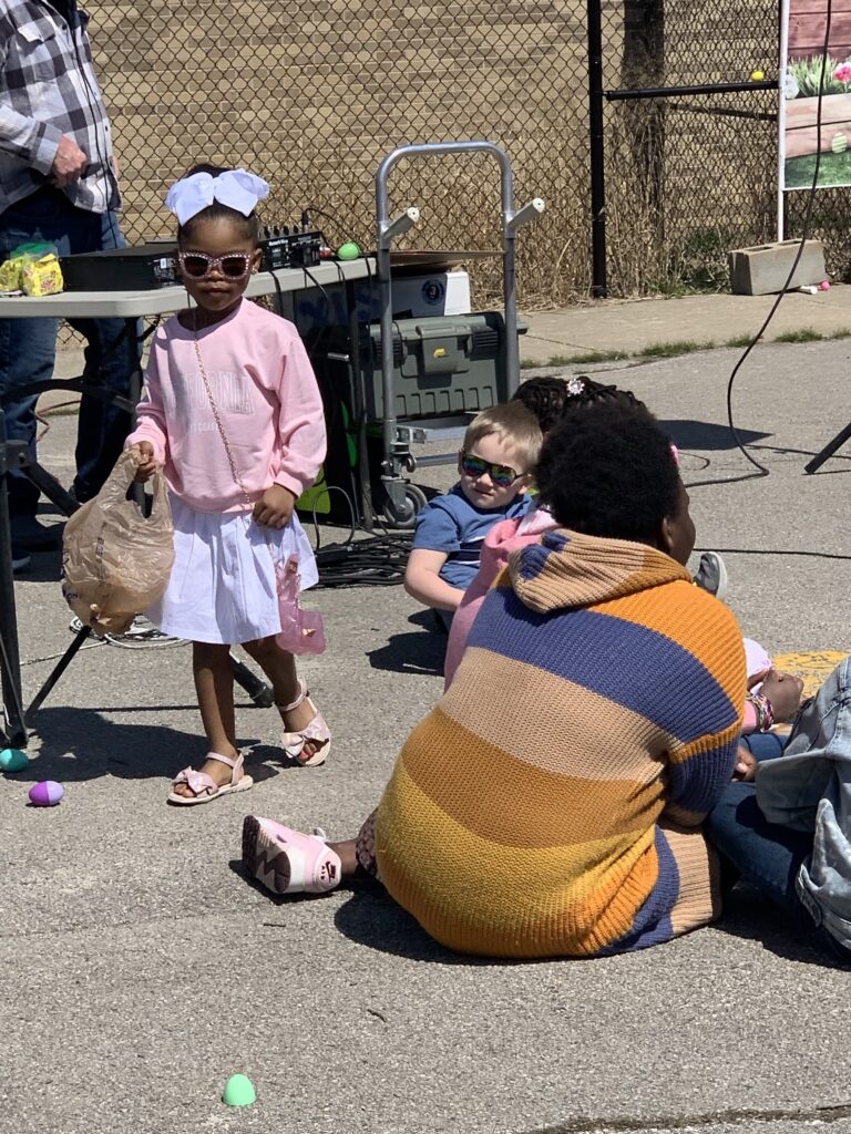 Children gathered outdoors during the CCR Easter celebration.